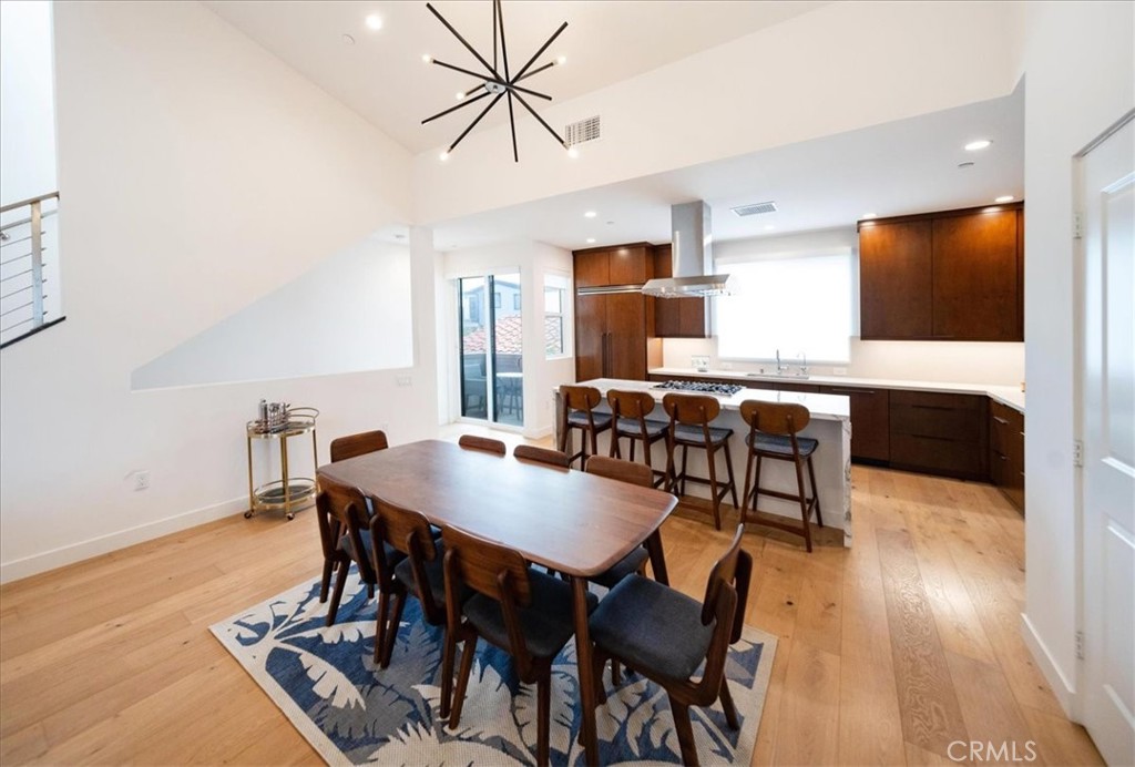 3632 Garfield Street Carlsbad, CA 92008 - Photo 11 of 50 a view of a dining room with furniture and wooden floor