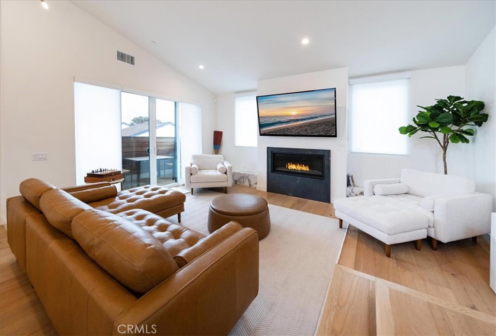 3632 Garfield Street Carlsbad, CA 92008 - Photo 12 of 50 a living room with furniture and a fireplace