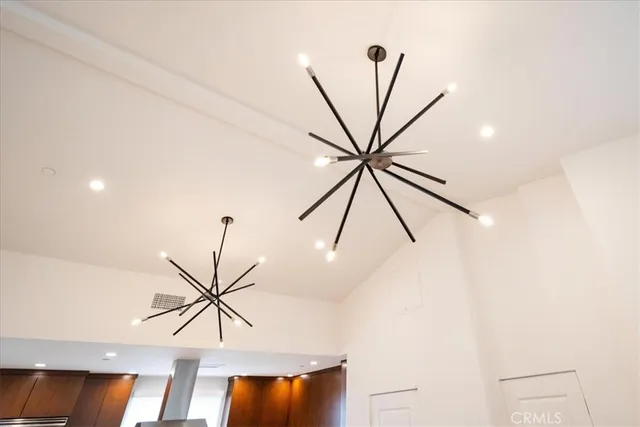 a roof deck with table and chairs