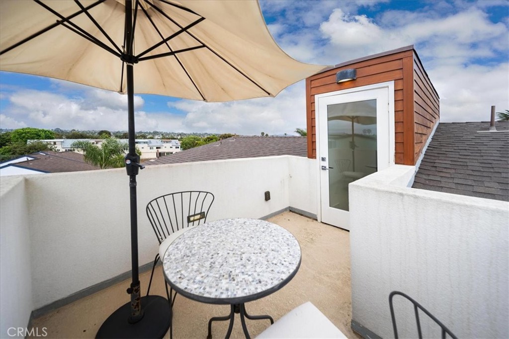 3632 Garfield Street Carlsbad, CA 92008 - Photo 24 of 50 a view of a chairs and table in the balcony