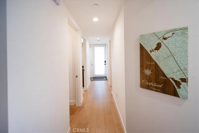 a large bed sitting in a bedroom next to a window