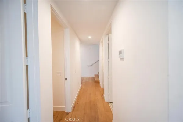 a large white bed in a white room