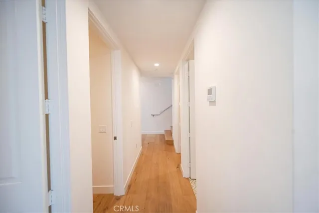 a large white bed in a white room