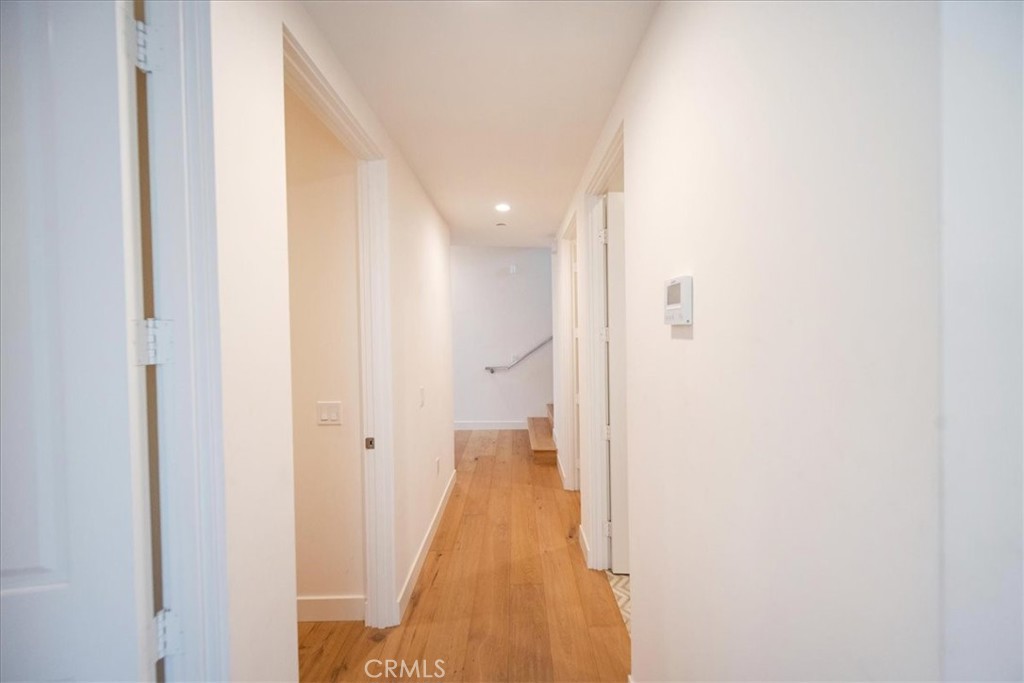 3632 Garfield Street Carlsbad, CA 92008 - Photo 27 of 50 a view of a hallway with wooden floor