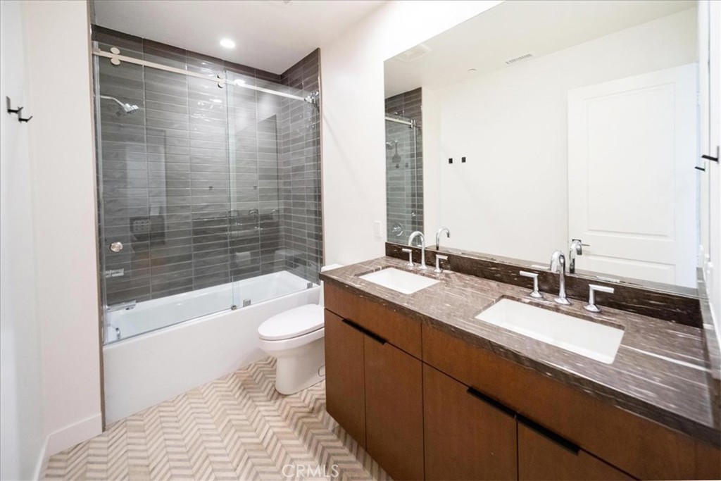 3632 Garfield Street Carlsbad, CA 92008 - Photo 33 of 50 a bathroom with a granite countertop sink toilet and shower