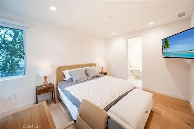 a bathroom with a bathtub shower and a sink