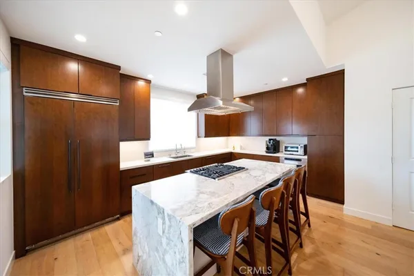a kitchen with a table and chairs