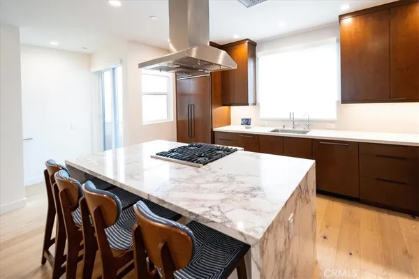 a kitchen that has a lot of cabinets in it