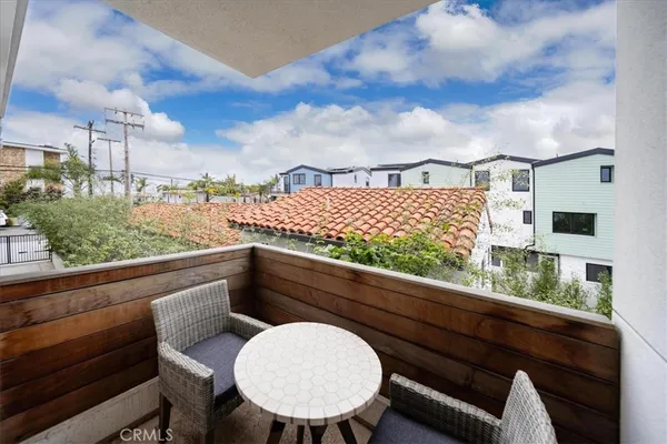 a living room with fireplace furniture and a wooden floor