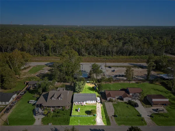 aerial view of a house with outdoor space and street view