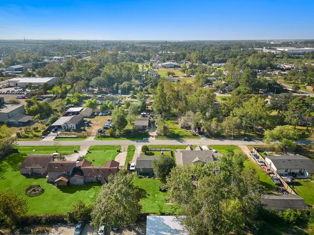an aerial view of residential house with outdoor space and swimming pool