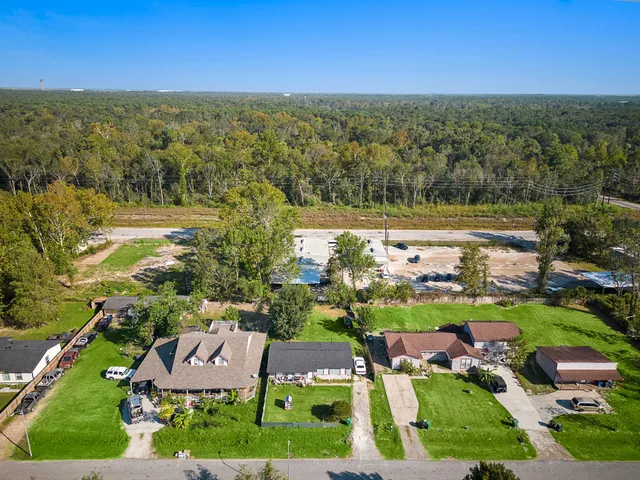 a view of a city with lots of residential buildings ocean and mountain view