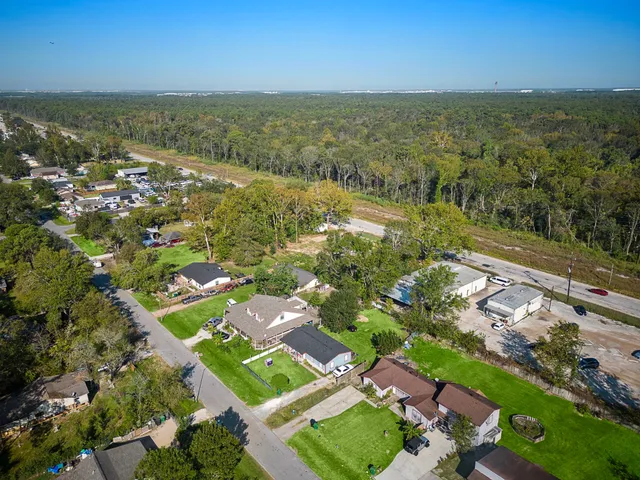 an aerial view of residential houses with outdoor space