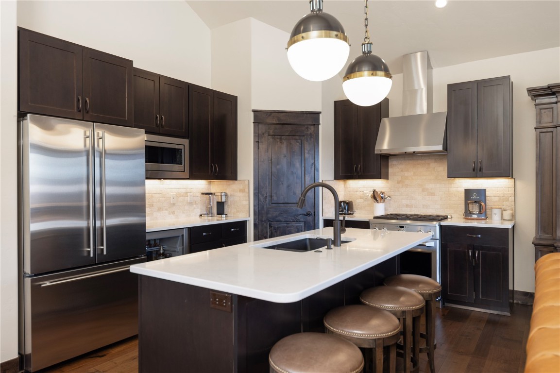 58 Erickson Loop, Unit 13A Keystone, CO 80435 - Photo 3 of 28 a kitchen with a refrigerator a stove a sink and a refrigerator