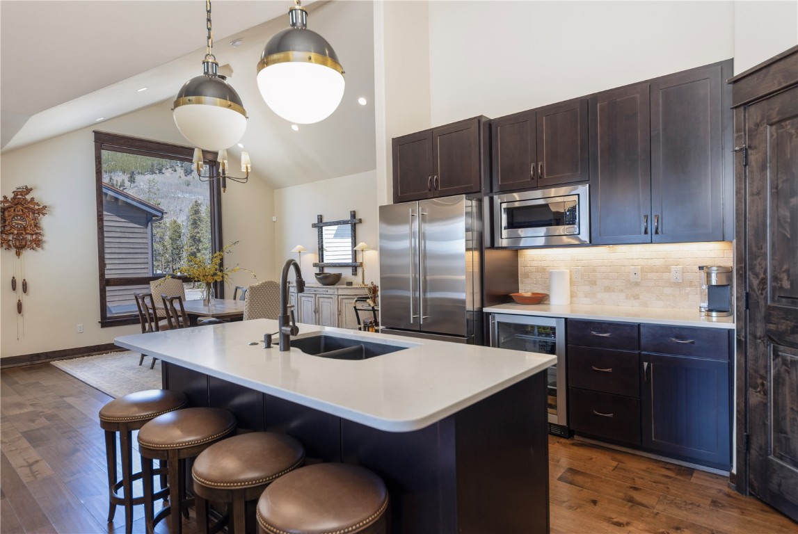 58 Erickson Loop, Unit 13A Keystone, CO 80435 - Photo 4 of 28 a kitchen with kitchen island a cabinets counter space and appliances
