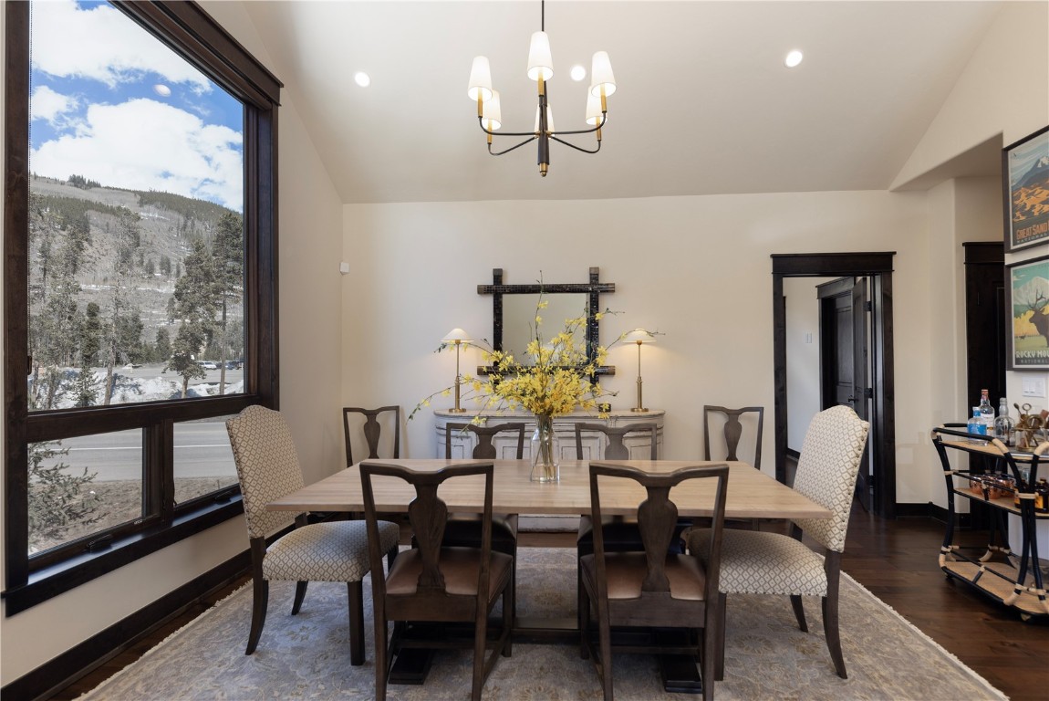 58 Erickson Loop, Unit 13A Keystone, CO 80435 - Photo 5 of 28 a view of a dining room with furniture a chandelier and wooden floor