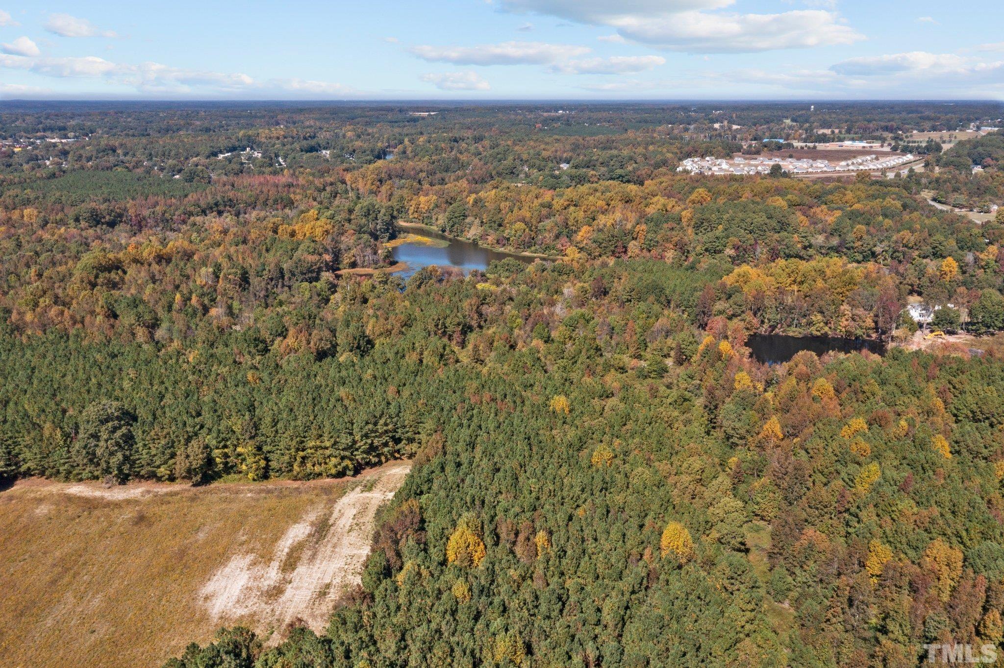 0 Garrett Road Henderson, NC 27536 - Photo 19 of 20 an aerial view of residential houses with city view