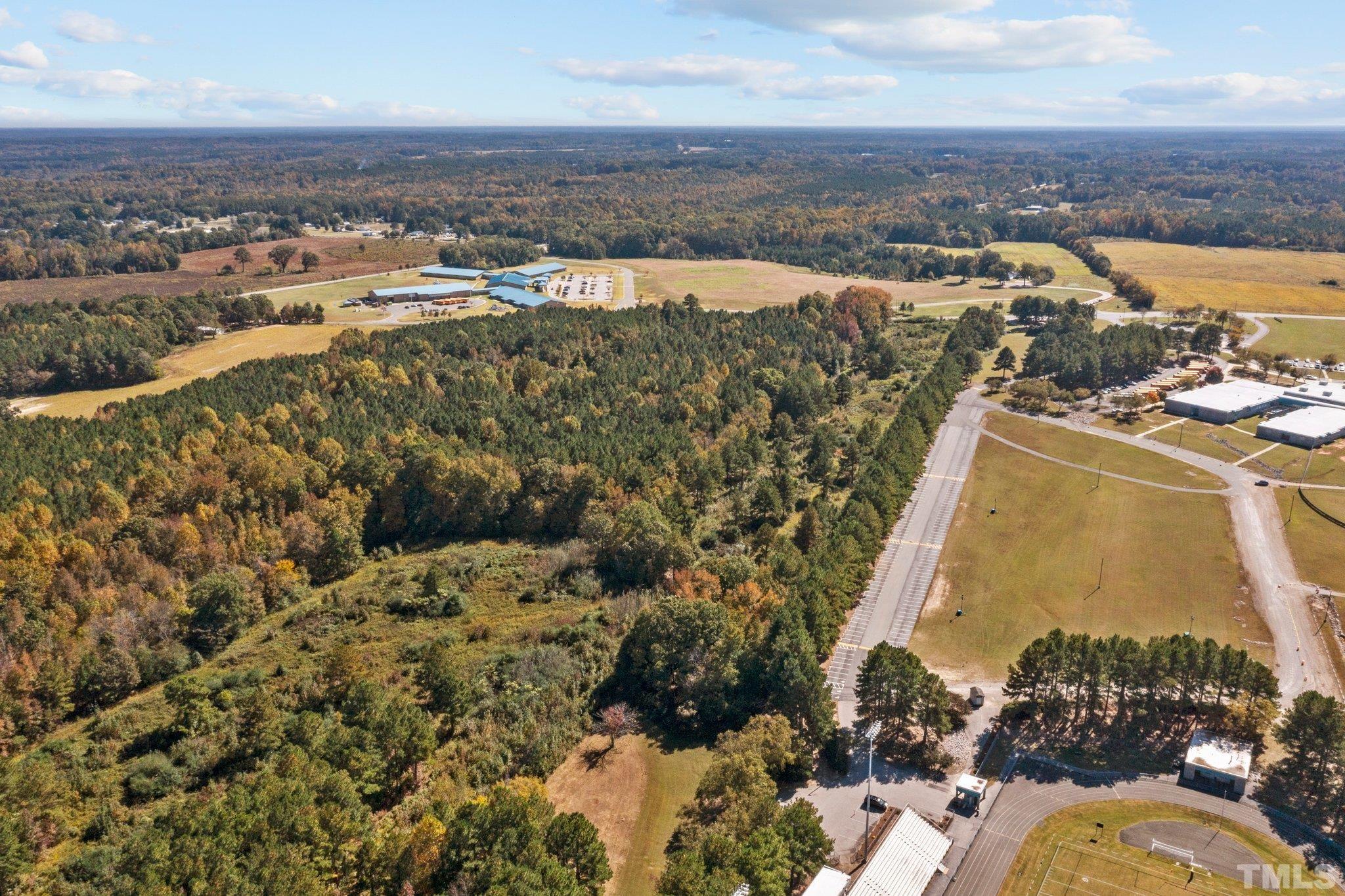 0 Garrett Road Henderson, NC 27536 - Photo 6 of 20 an aerial view of a house with a lake view
