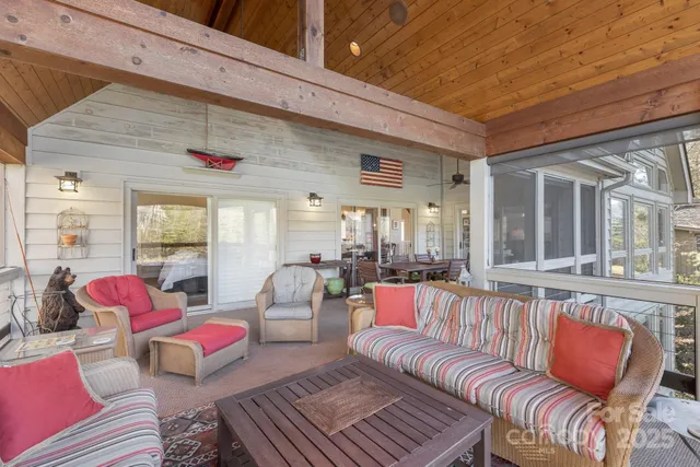 a living room with furniture or couch and a large window