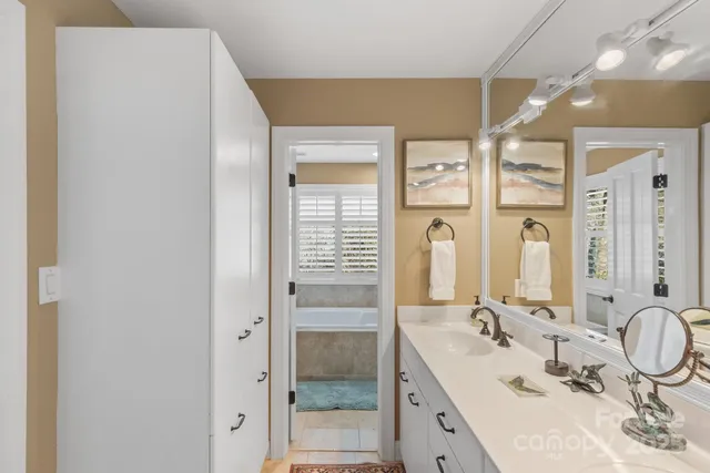 a bathroom with a double vanity sink mirror and double