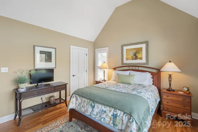 a bedroom with a bed and a desk