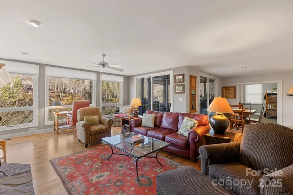a living room with furniture or couch and a large window