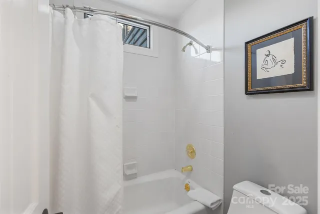 a view of a lake with a house in the background