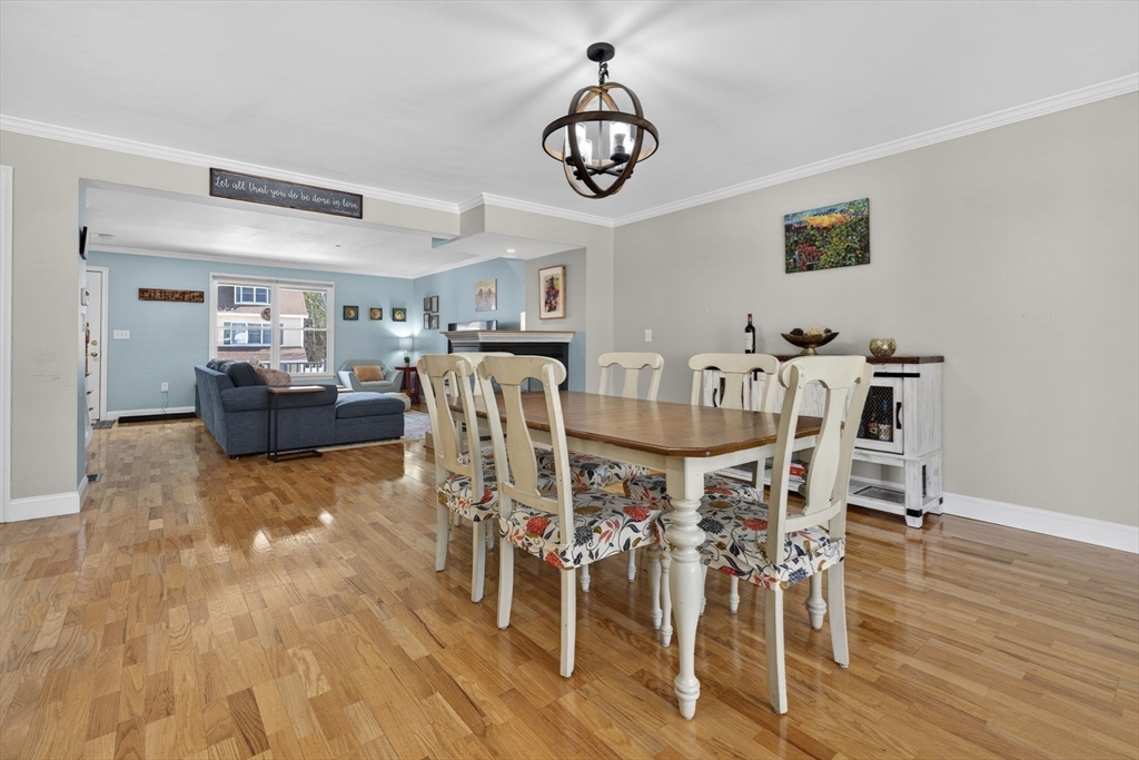 216 Rangeway Road, Unit 133 North Billerica, MA 01862 - Photo 8 of 42 a view of a dining room with furniture and wooden floor