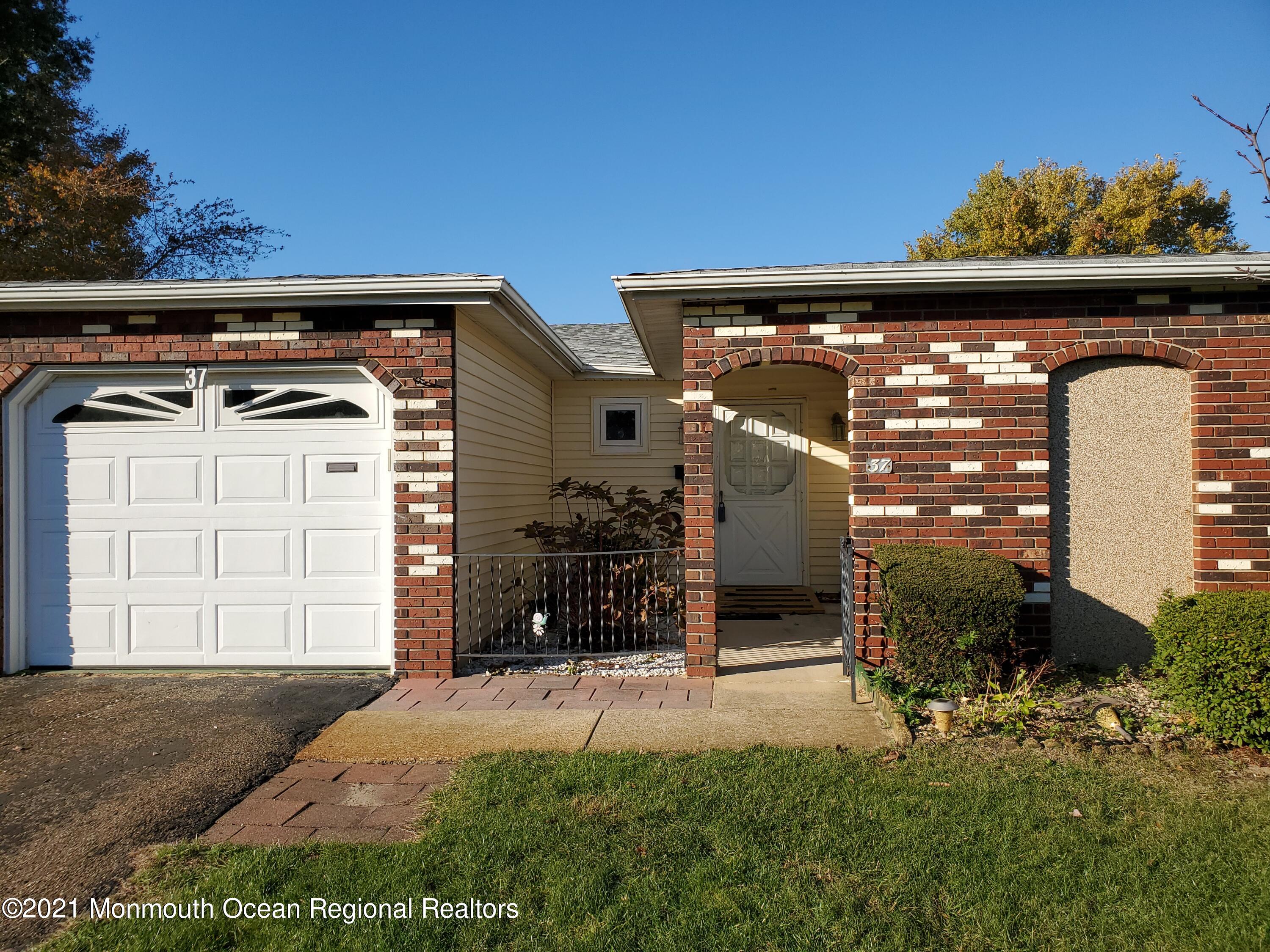 37 Patmore Road Brick, NJ 08724 - Photo 1 of 19 a front view of a house with a garage