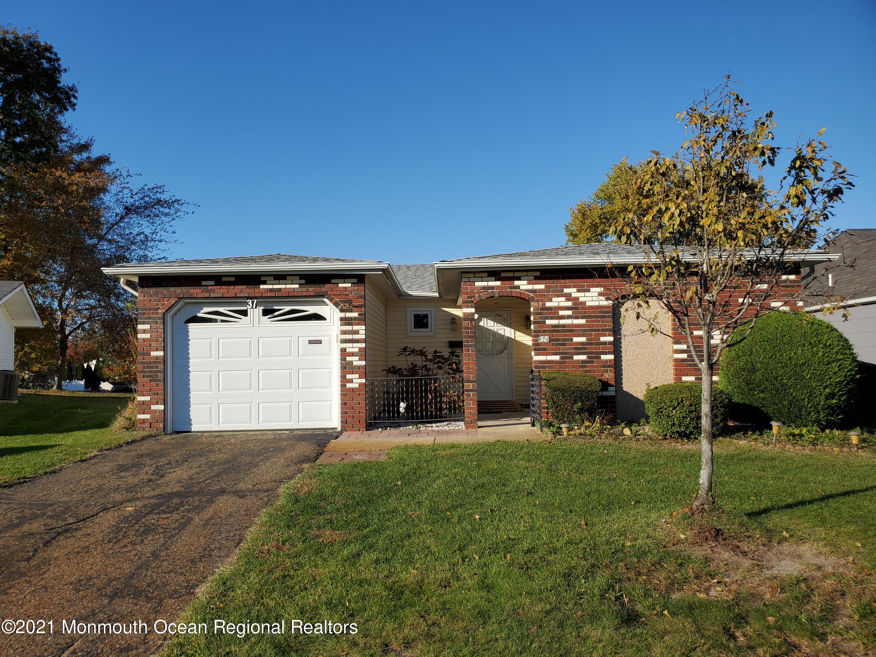 37 Patmore Road Brick, NJ 08724 - Photo 17 of 19 a view of a house with a park