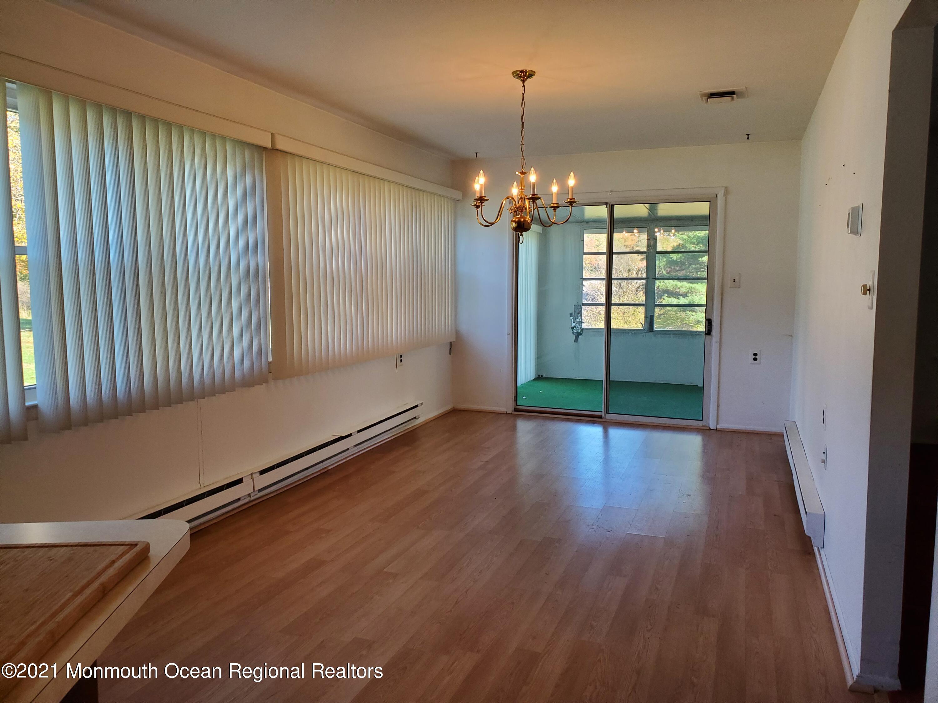 37 Patmore Road Brick, NJ 08724 - Photo 7 of 19 an empty room with wooden floor and window