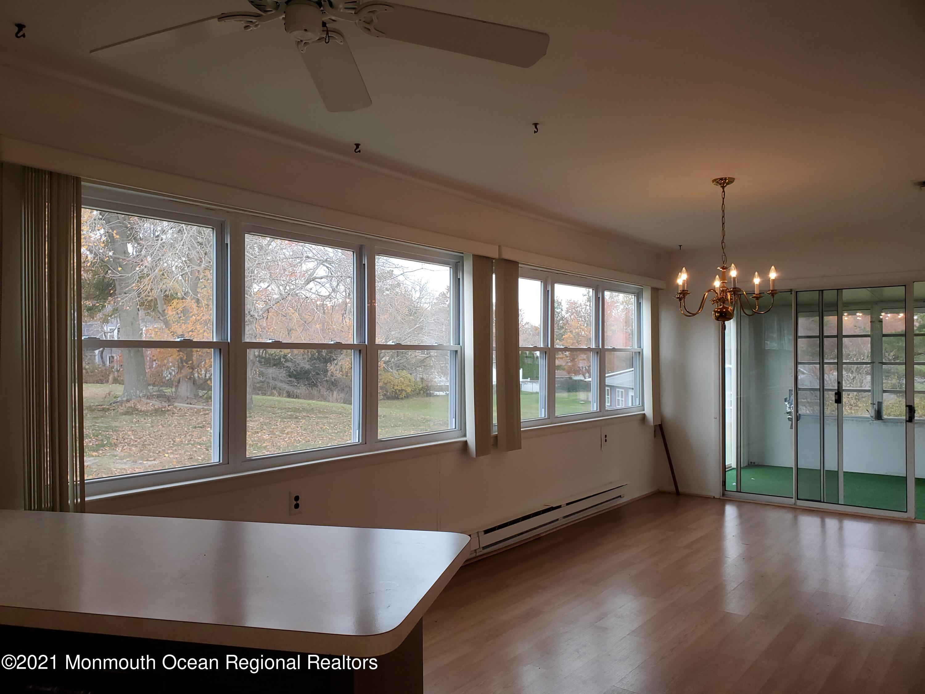 37 Patmore Road Brick, NJ 08724 - Photo 8 of 19 a view of an empty room with wooden floor and a window