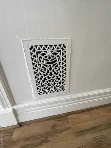 a kitchen with a sink cabinets stainless steel appliances and a window