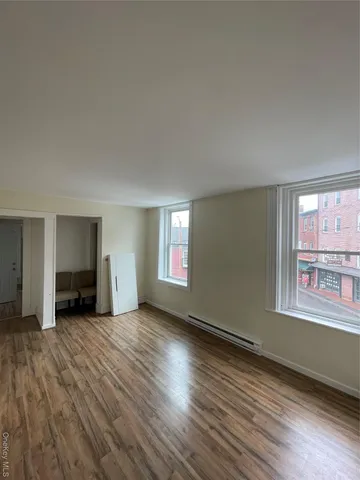 a view white cabinets and a wooden floor
