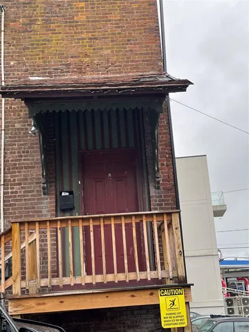 a view of a brick building with many windows