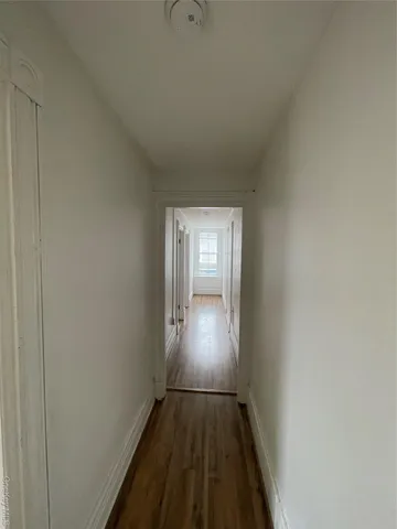 a view of entryway with wooden floor