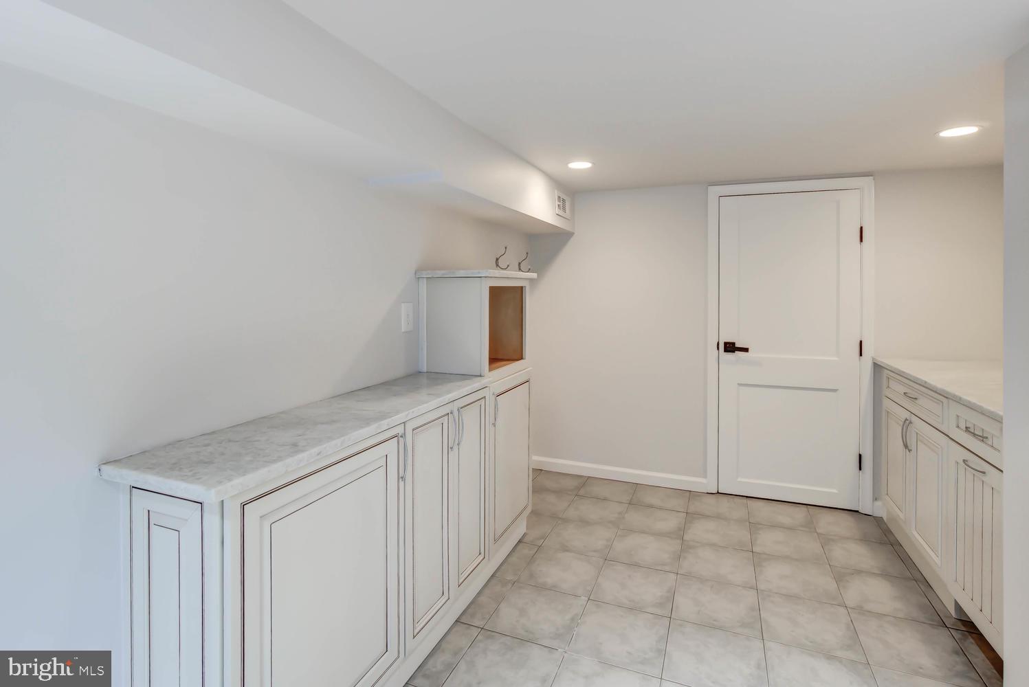 2900 Franklin Road Arlington, VA 22201 - Photo 59 of 75 Laundry Room - with cabinetry and countertop