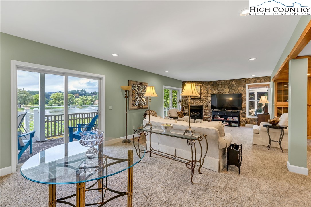 342 Birkdale Ridge Jefferson, NC 28640 - Photo 23 of 50 a living room with fireplace furniture and a large window
