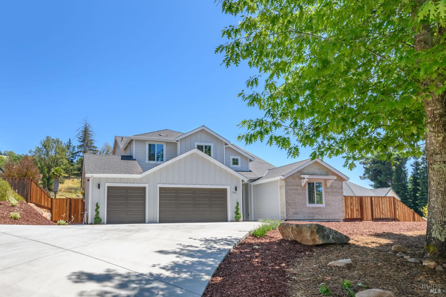 1970 Bent Tree Place Santa Rosa, CA 95404 - Photo 1 of 1 a front view of a house with a yard and garage