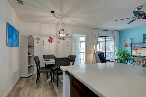 a view of a dining room with furniture and wooden floor