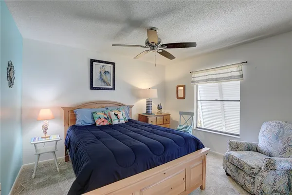 a bedroom with bed and window