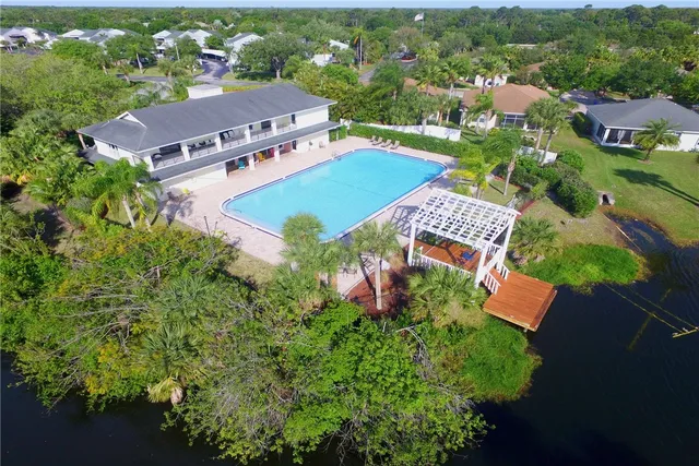 an aerial view of house with yard swimming pool and outdoor seating