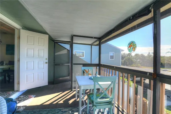 a balcony with furniture and outdoor seating