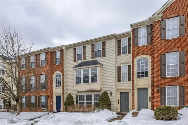 a front view of a building with many windows