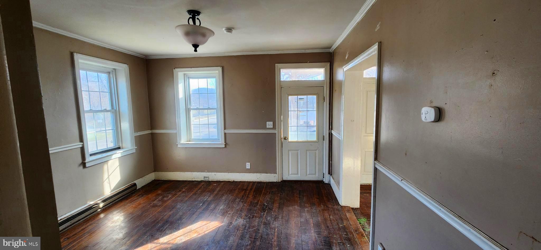 734 Bridgeport Road Landisburg, PA 17040 - Photo 13 of 39 wooden floor in an empty room with a window