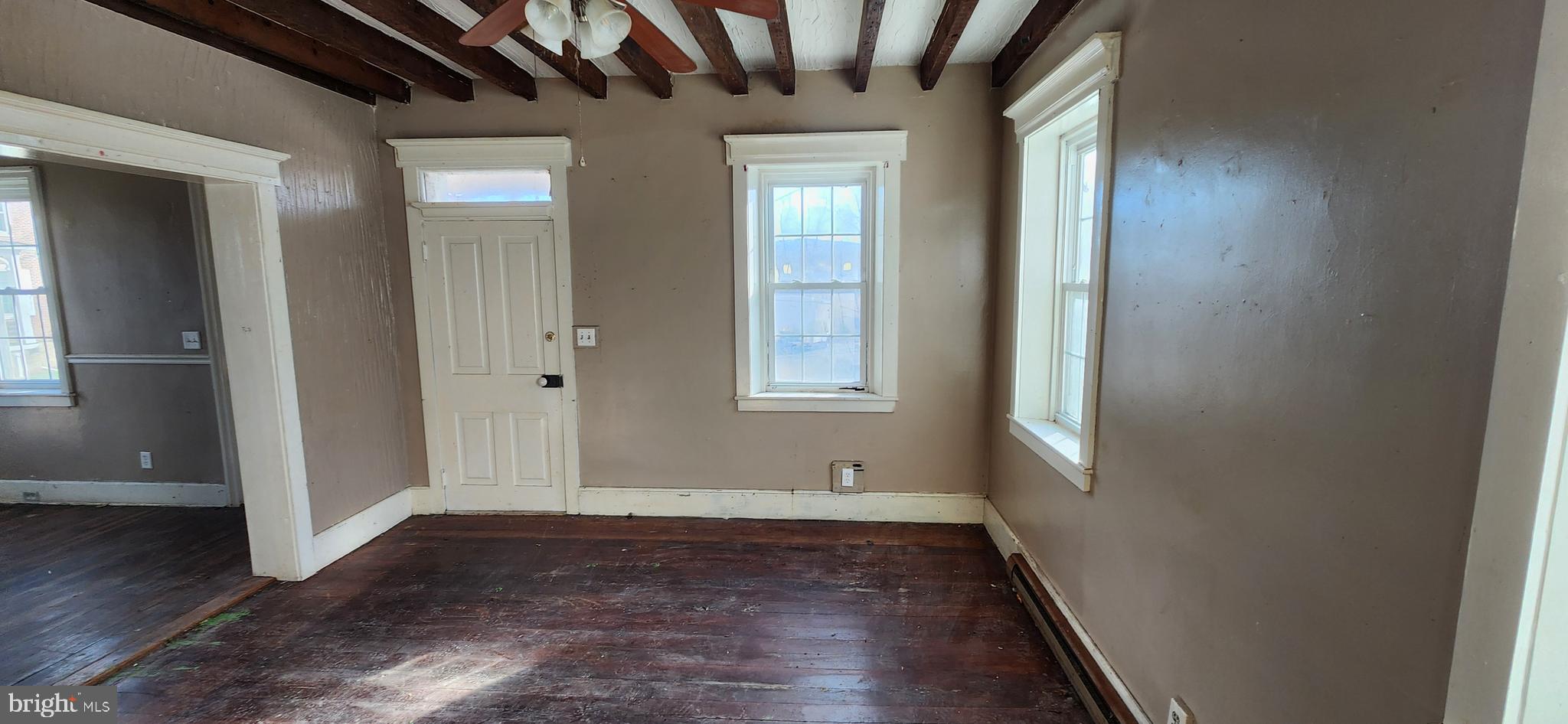 734 Bridgeport Road Landisburg, PA 17040 - Photo 17 of 39 an empty room with wooden floor and windows