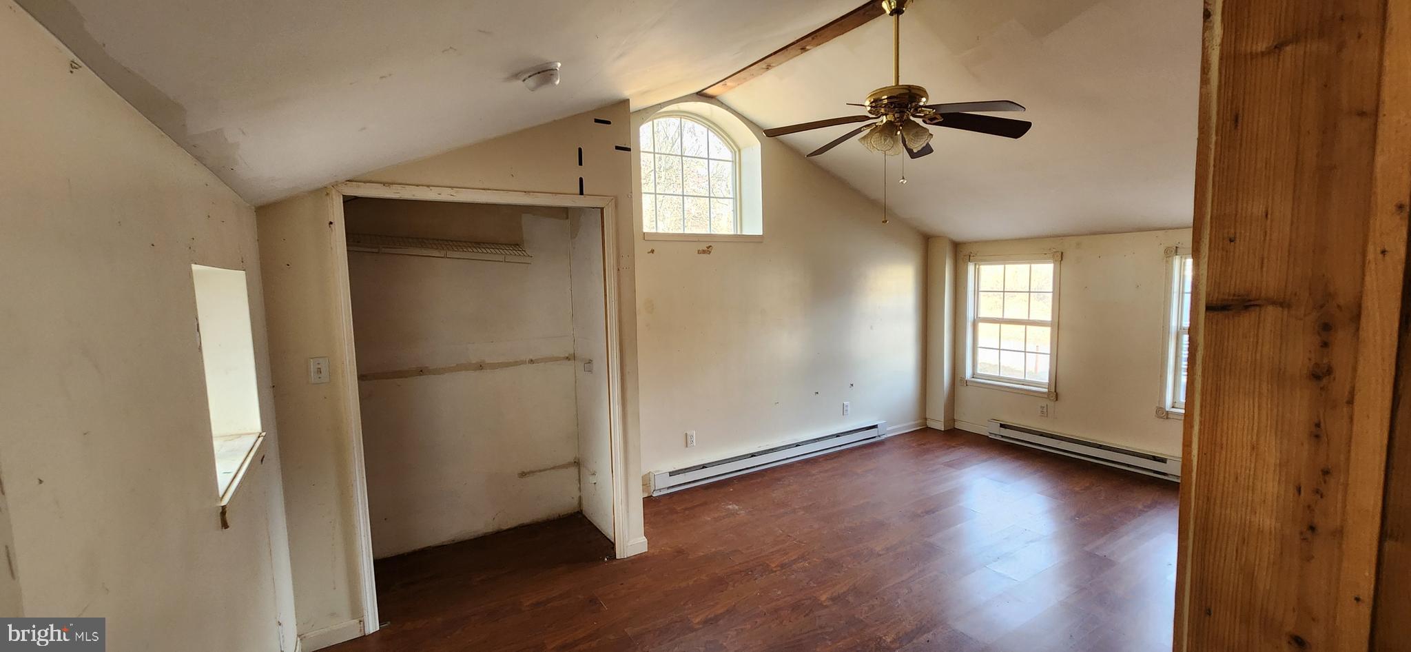 734 Bridgeport Road Landisburg, PA 17040 - Photo 24 of 39 an empty room with wooden floor cabinet and windows