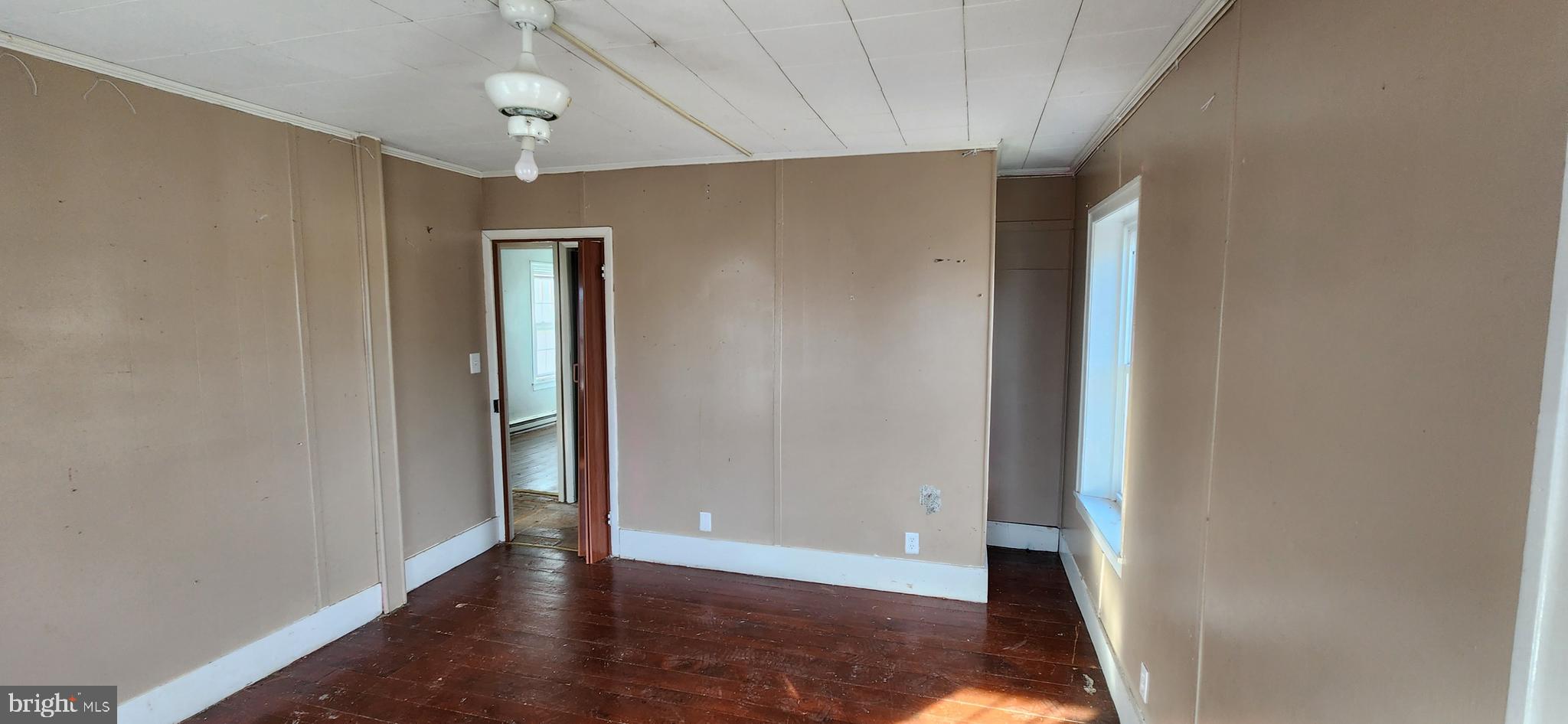 734 Bridgeport Road Landisburg, PA 17040 - Photo 31 of 39 a view of an empty room with wooden floor