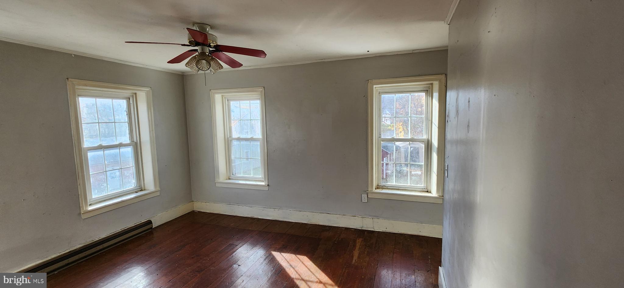 734 Bridgeport Road Landisburg, PA 17040 - Photo 36 of 39 a view of an empty room with wooden floor and a window