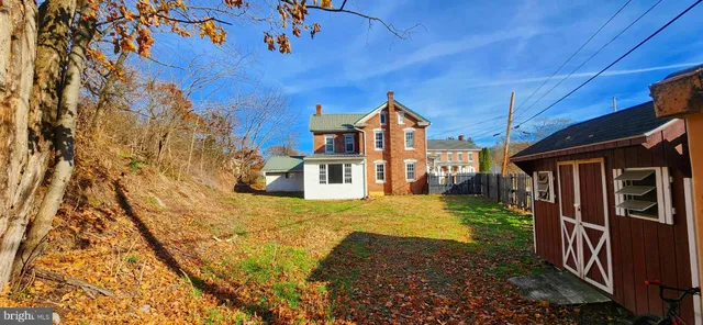 a view of a house with a small yard